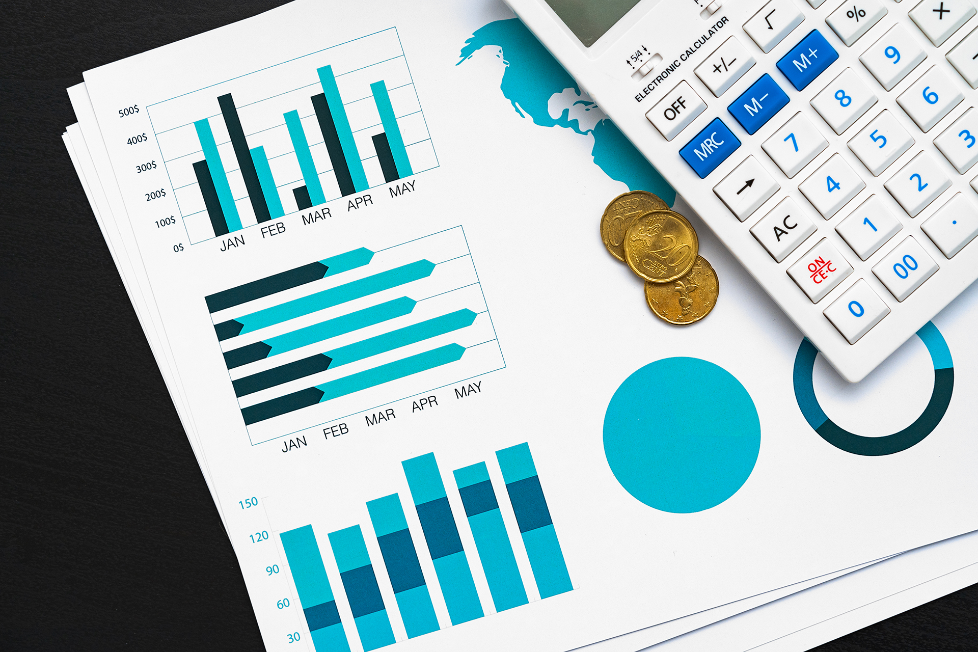 Top view of table with financial papers and calculator