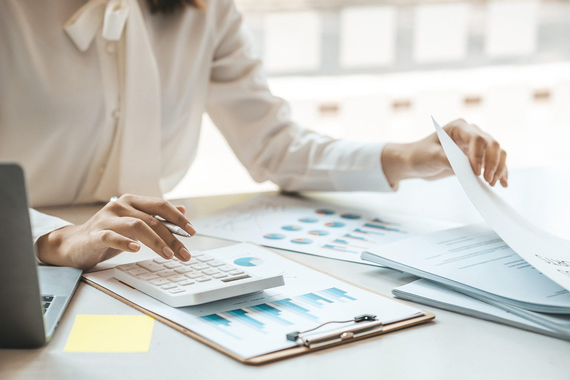 businessman-using-a-calculator-to-calculate-number-2023-11-27-05-24-55-utc